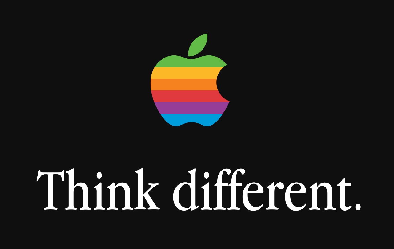 Радужный логотип Apple над текстом Think Different. на черном фоне.