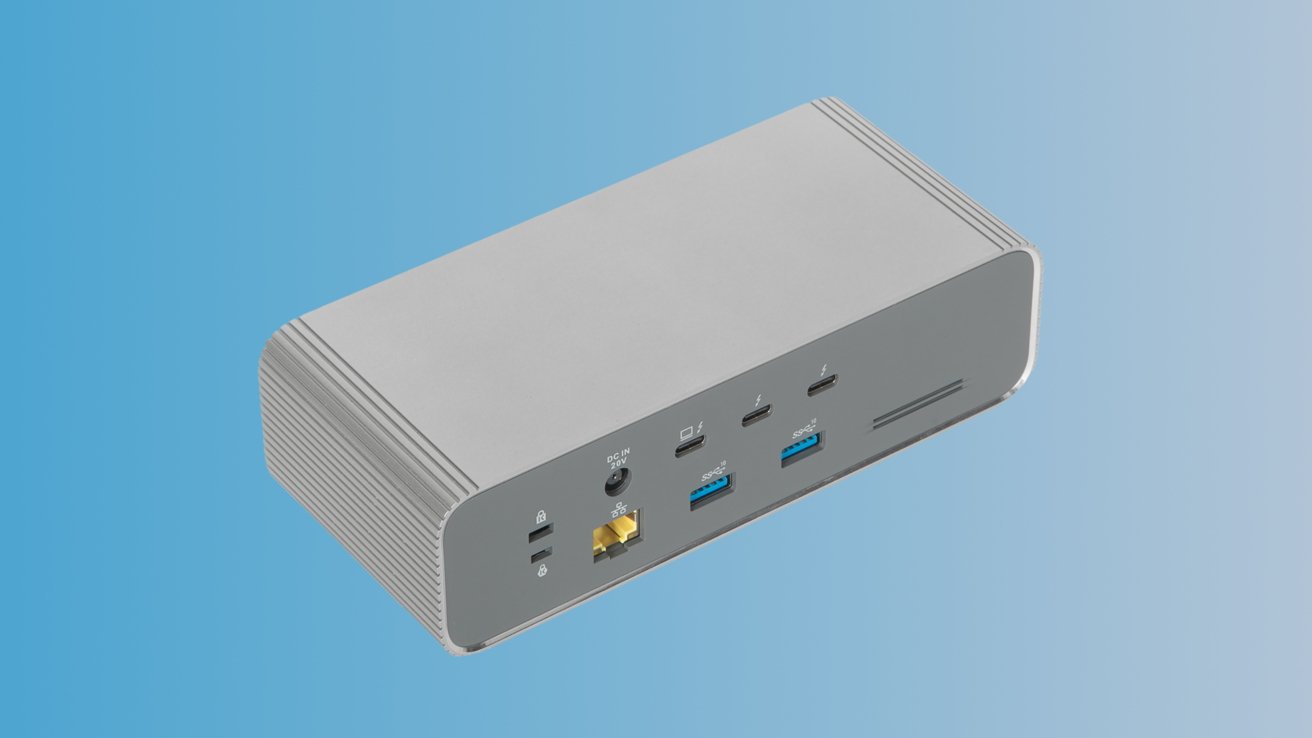 Прямоугольное серебристое устройство с несколькими портами, включая USB, Ethernet и вход питания, на градиентном синем фоне.