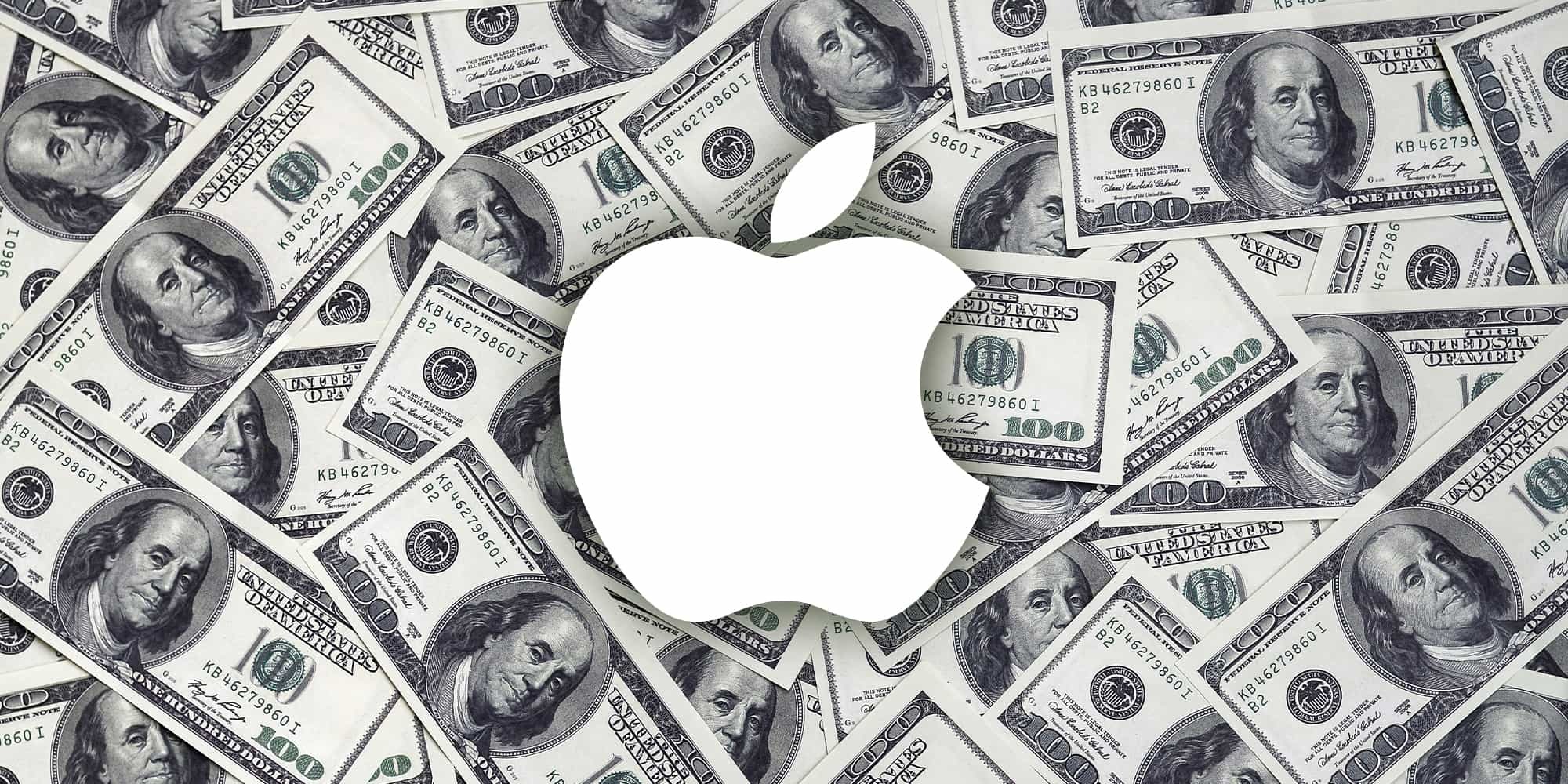Логотип Apple поверх большого количества денег